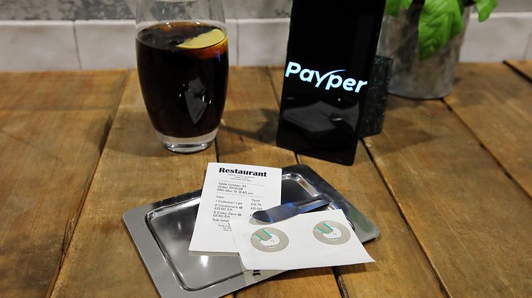 Payper has launched a new restaurant payment method. Using graphene-enhanced receipt paper, the user simply places their phone on t