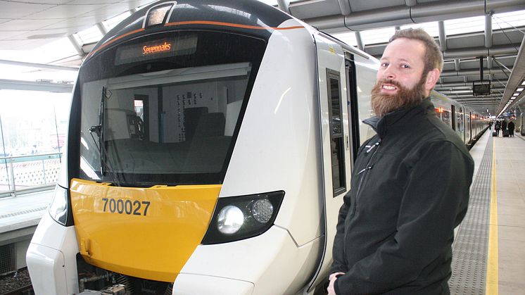 Newly-qualified Thameslink driver Paul Butler alongside the first train he drove from Blackfriars