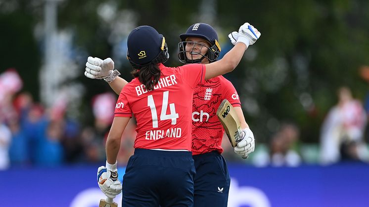 Amy Jones and Maia Bouchier celebrate hitting the winning runs. Photo: Getty Images