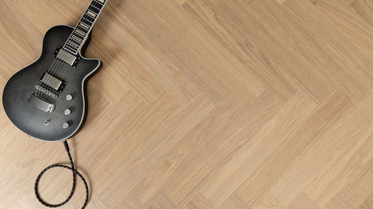 The classic herringbone patterned oak strips have been scaled up to fit larger surfaces.
