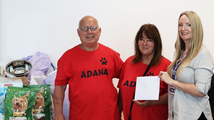 Hugely appreciated: ADANA's Reg Winkworth and Susan Brown accept cash and supplies donations from ECC's Sharon Johnson