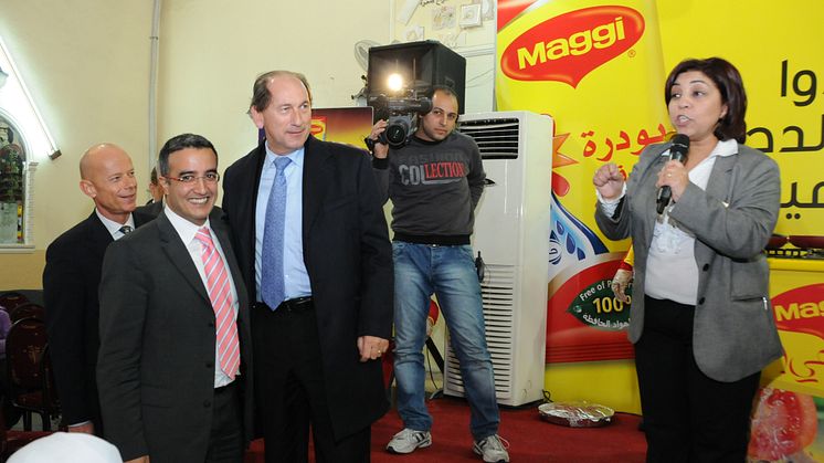 Assma Tellawi on the right together with the Chairman of Nestlé, Mr. Paul Bulcke (blue shirt/tie).