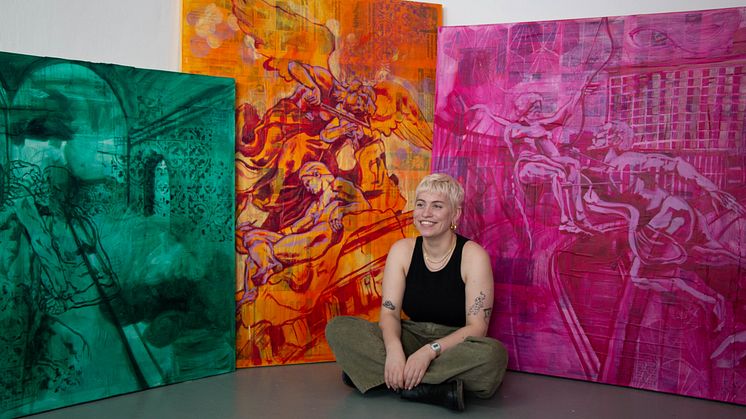Award winning Fine Art student, Sophie Woodward, pictured with some of her paintings