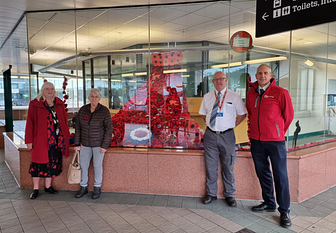 Poppy display - two customers who knitted poppies for the display, John Gordon (Bus Station Supervisor), Neil Kennedy (Driver)_.png