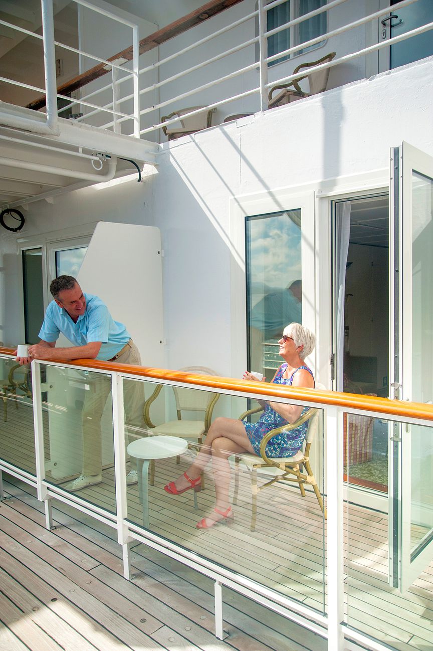Couple sitting out on Room Balcony 