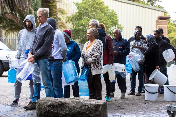 Facing urban water scarcity, Cape Town citizens line up for drinking water during the city's 2018 water crisis (Credit: Cavan / Alamy Stock Photo)