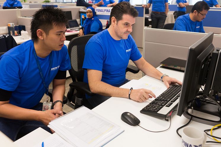 Creating the first shipment using the new SAP Transportation Management application: Stefan Karlen, RCEO Asia Pacific under the watchful eyes of Shaun Mak,  Air Freight document processor.