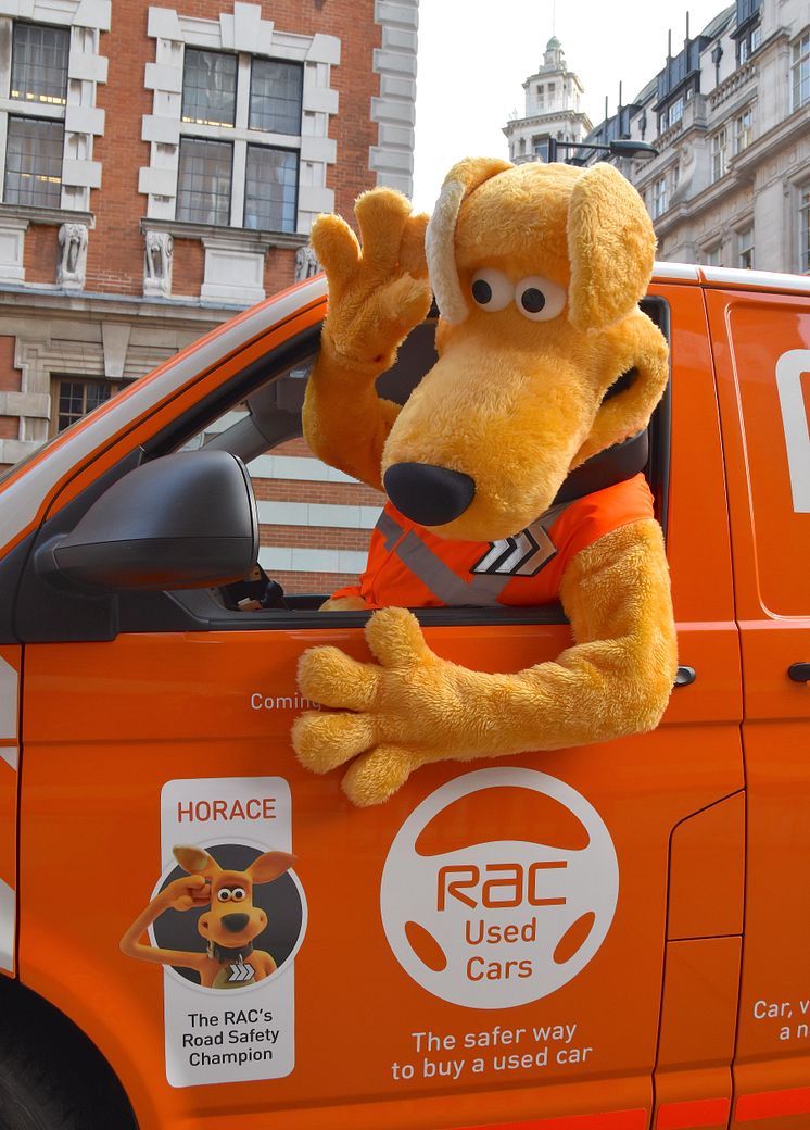 Horace giving a wave from an RAC patrol van