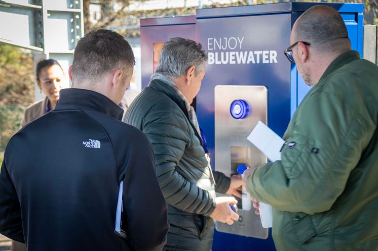 Rush to fill sustainable water bottles with Bluewater at 21st century EV recharging hub where single use plastic bottles of water are made a thing of the past