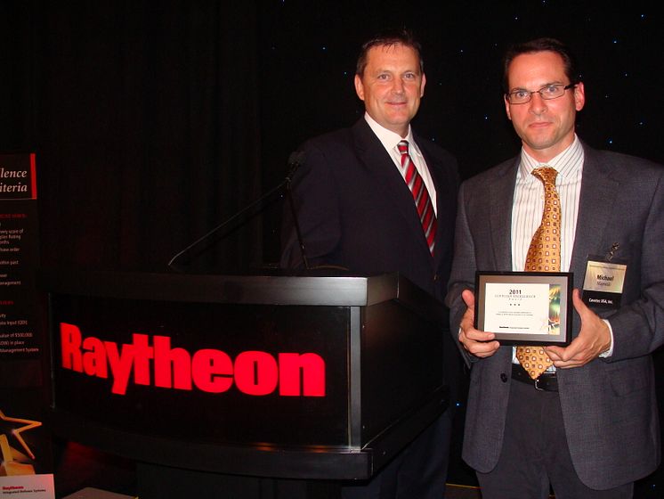 Cavotec USA's Mike Larkin and Michael Majewski receive Supplier Excellence Award from Raytheon Integrated Defense Systems