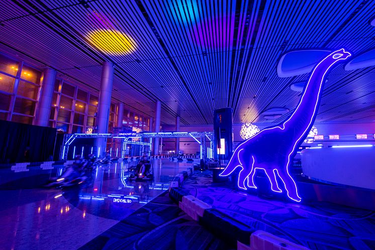 Dino Kart - Dinosaur-themed indoor electric go-kart track with neon lights at T4.jpg