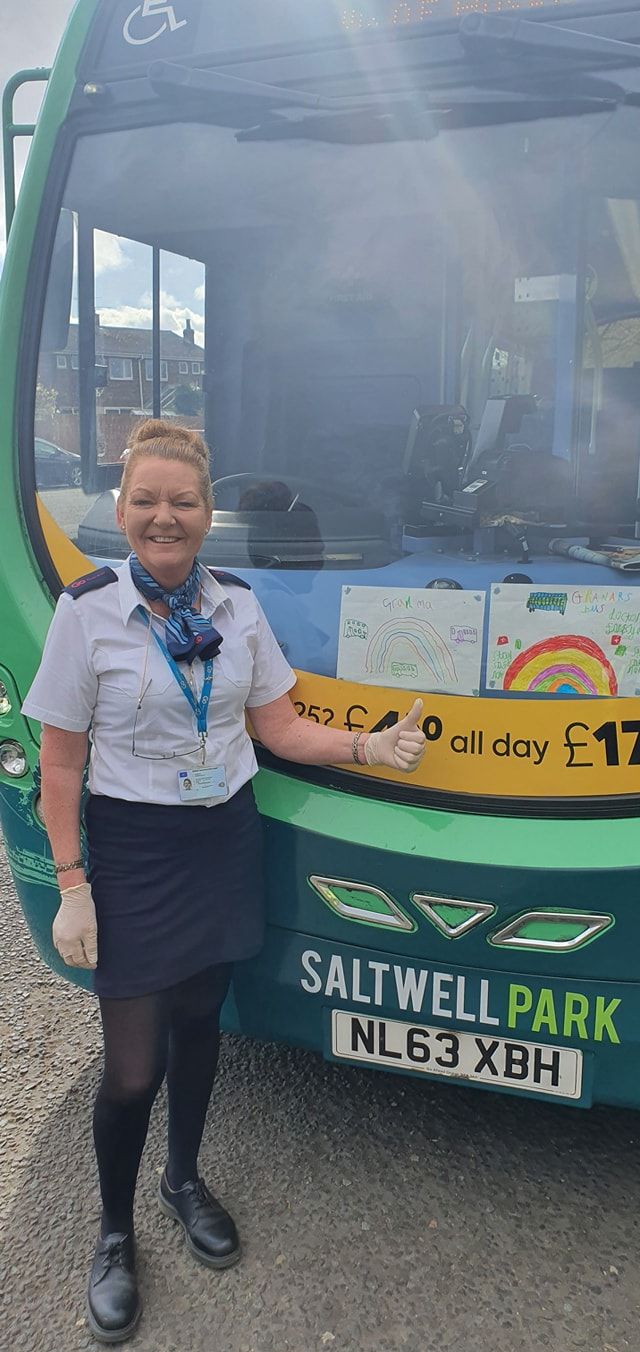 Go North East key worker with rainbow drawings to support fellow key workers
