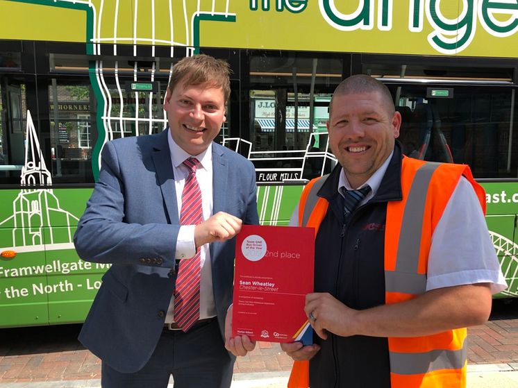 Sean Wheatley presented with his Team GNE Bus Driver of the Year runner-up certificate