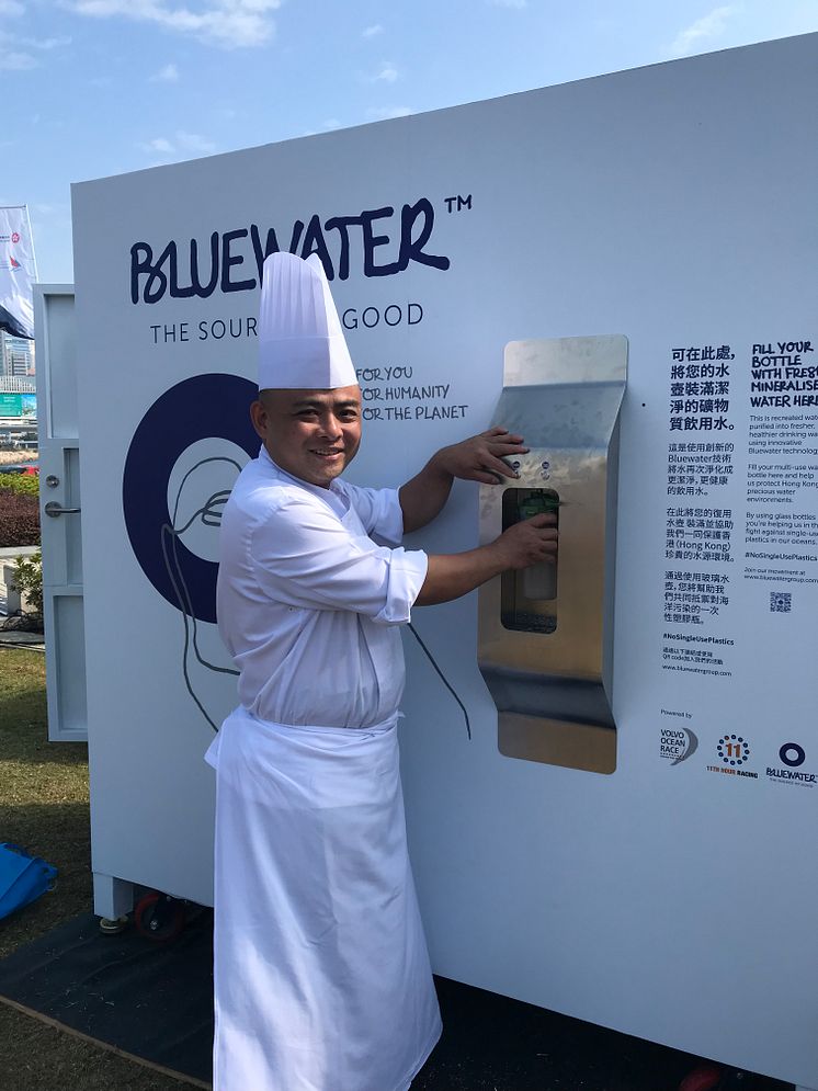 The pure water delivered from a Bluewater hydration station in the Volvo Ocean Race Village in Hong Kong puts a smile on the face of a Chinese chef .